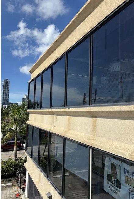 Building façade after drone-assisted softwashing, as shown in the company post