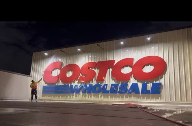 Costco storefront illuminated during the nighttime building-wash project