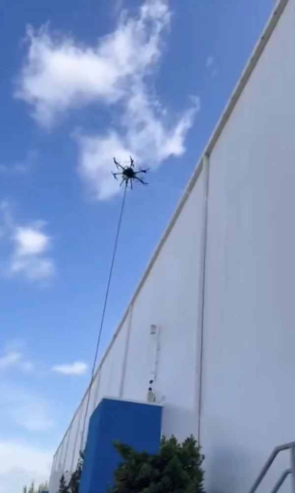 Drone softwashing a FreezPak facility in Hialeah.