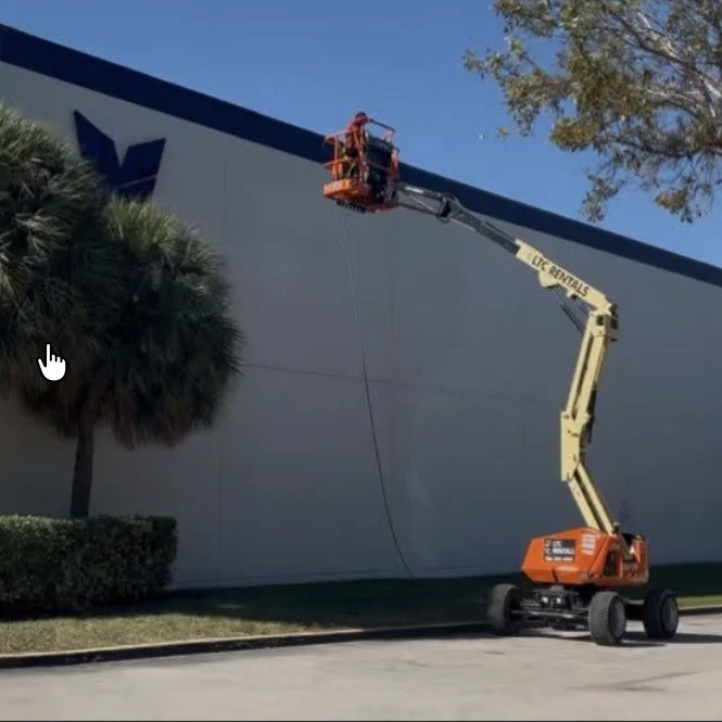 Elevated cleaning access beside another industrial exterior in Medley