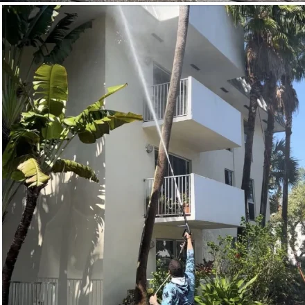 Another view of the building and lift during exterior cleaning