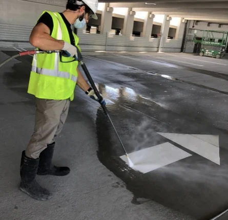 Pressure Kleen team member cleaning a surface during the Port of Miami garage project