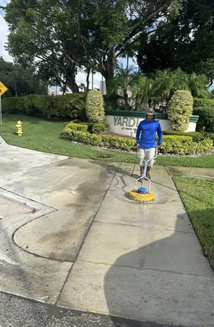 Surface-cleaning equipment in use on a Tamarac municipal sidewalk
