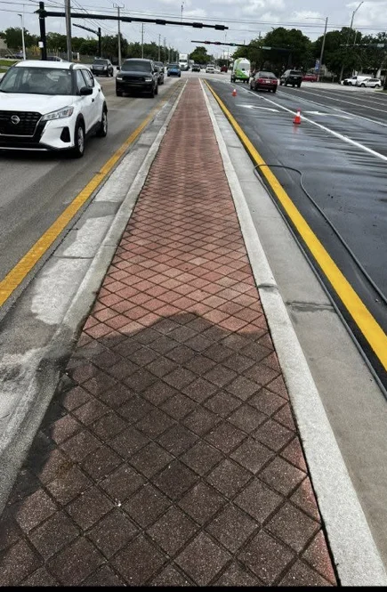 Brick-paver road median during City of Tamarac cleaning work