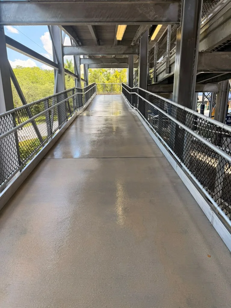 Covered access ramp with railings inside FIU Pitbull Stadium