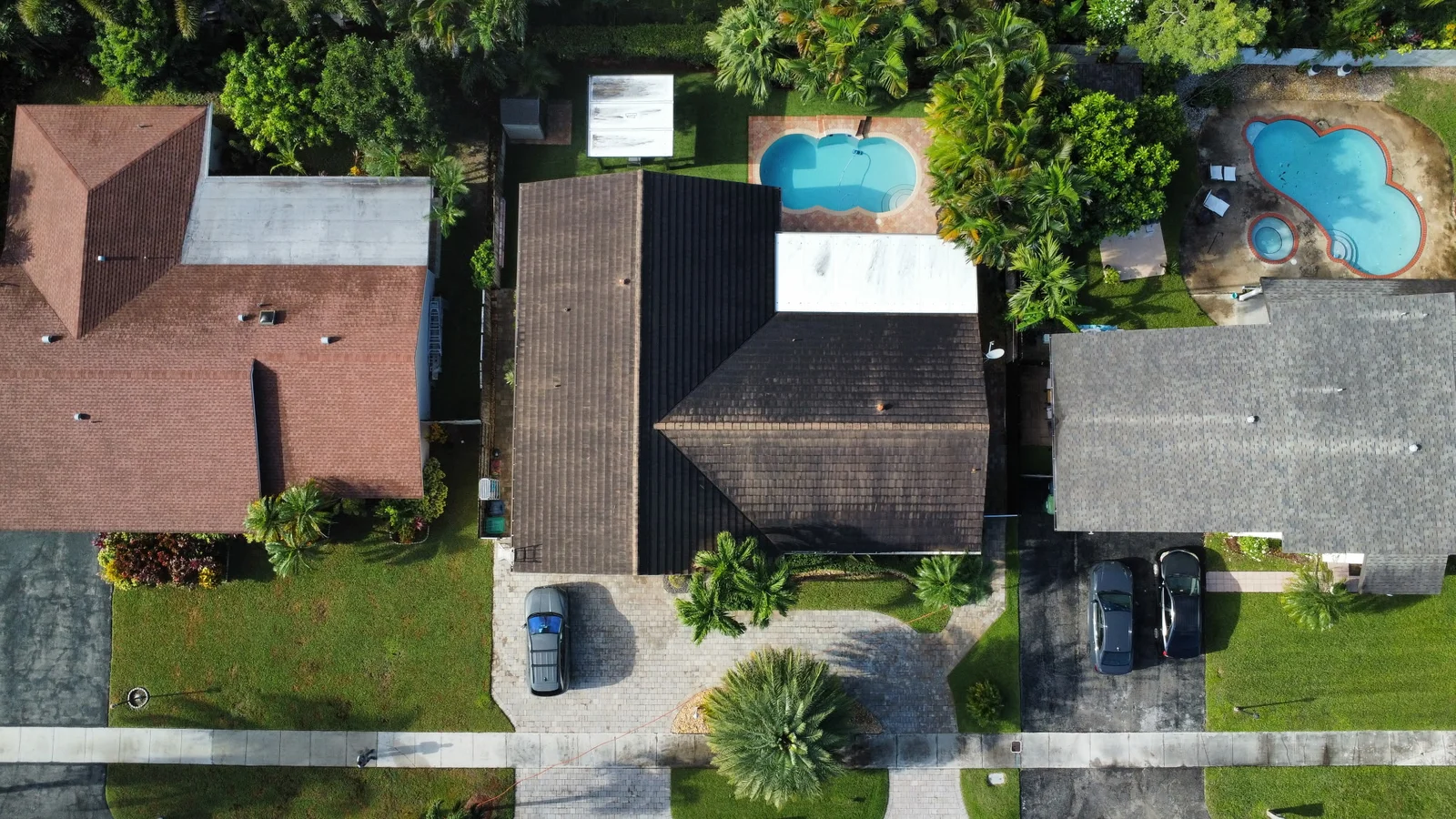 Aerial view of a darker residential roof before washing